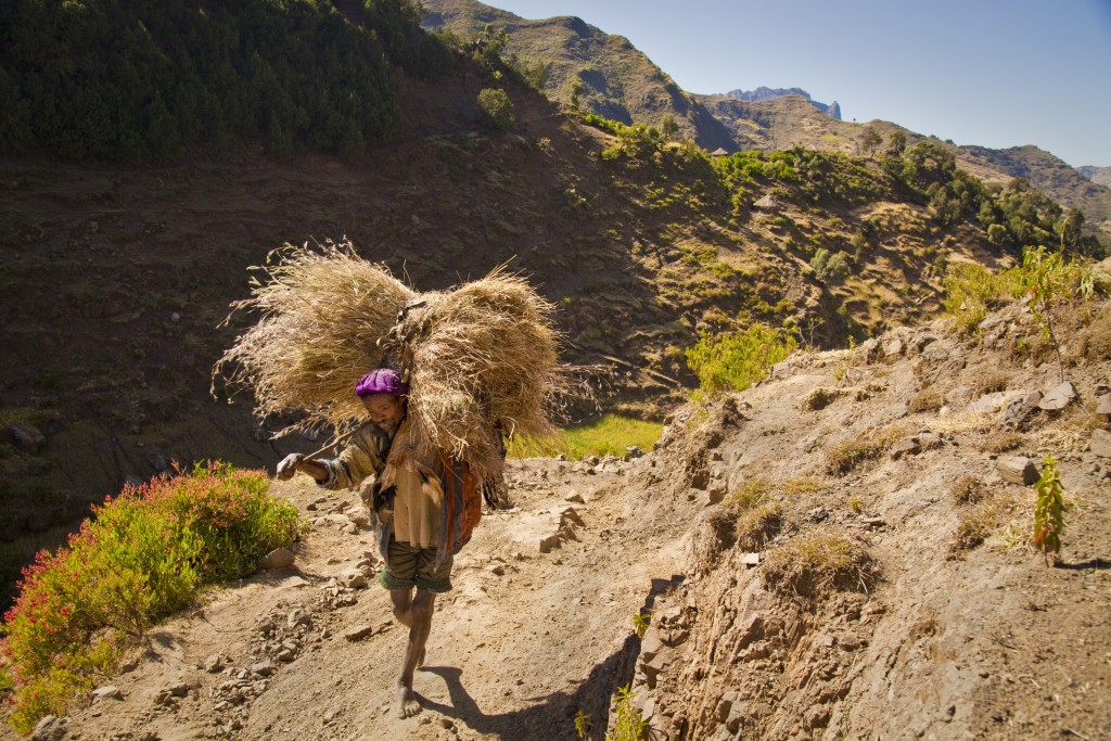 visit-ethopia-farmer-crossing-mountain